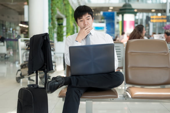 man working on his laptoo